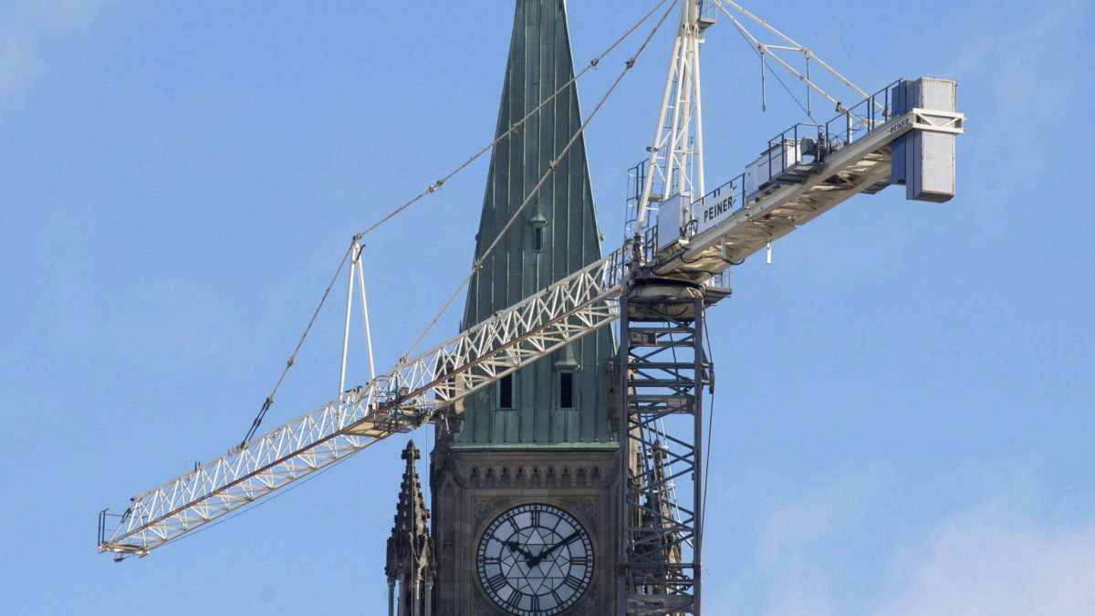 A crane is seen next to centre block during renovations to the parliamentary precinct, Monday, February 1, 2016 in Ottawa. THE CANADIAN PRESS/Adrian Wyld